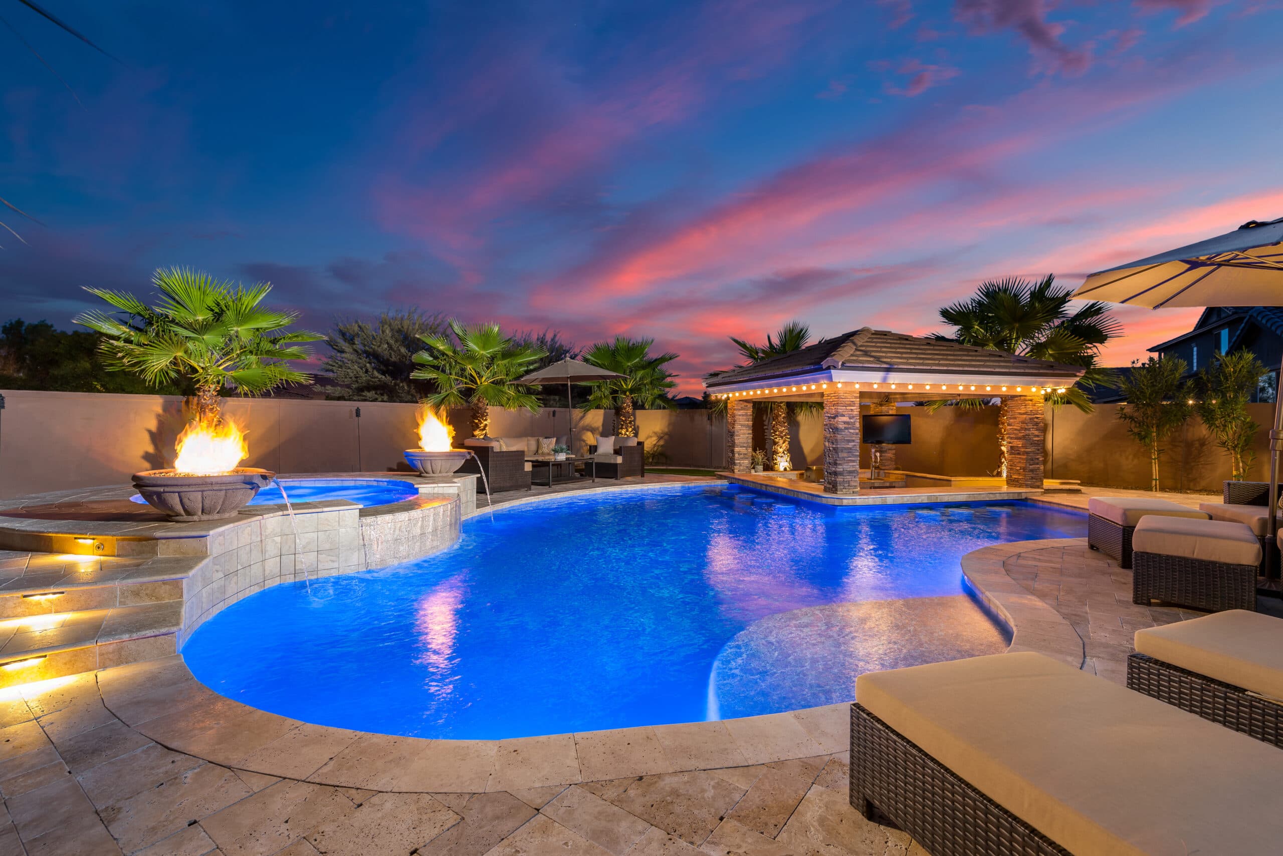 Crystal clear pool with Arizona desert landscape